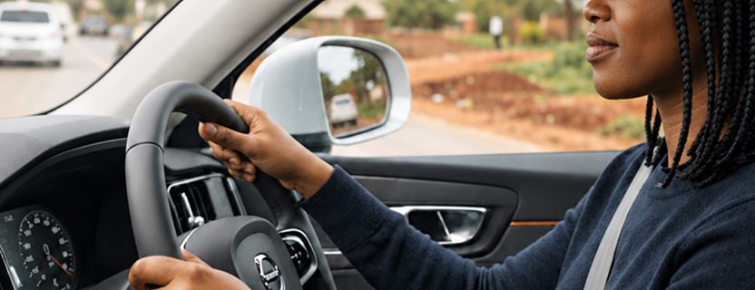 A driver at the wheel, seen from the passenger seat